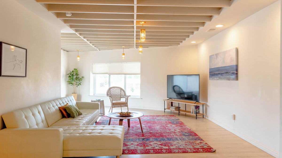Roseville Apartment | Spacious modern loft with a city view.