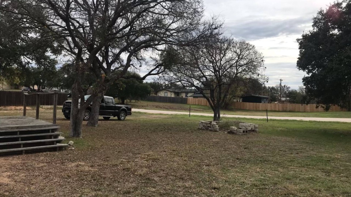 Tow House | Spacious open floor plan with beautiful oak trees.