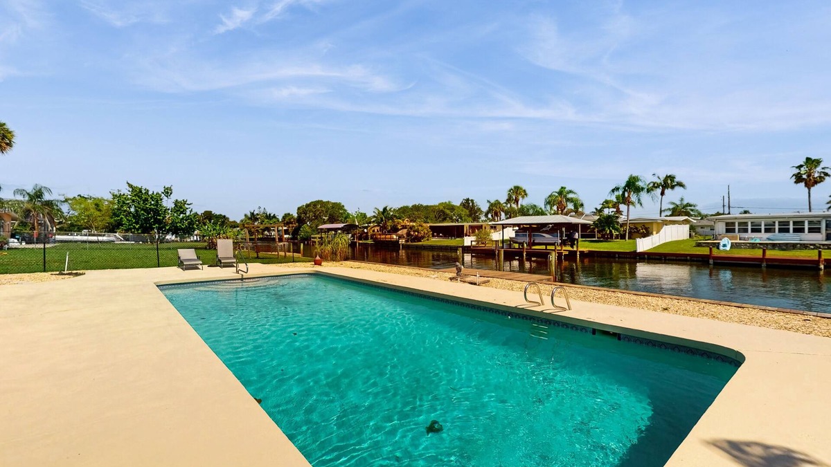Venetian Way House | Spacious waterfront home with private pool, sunroom and dock.