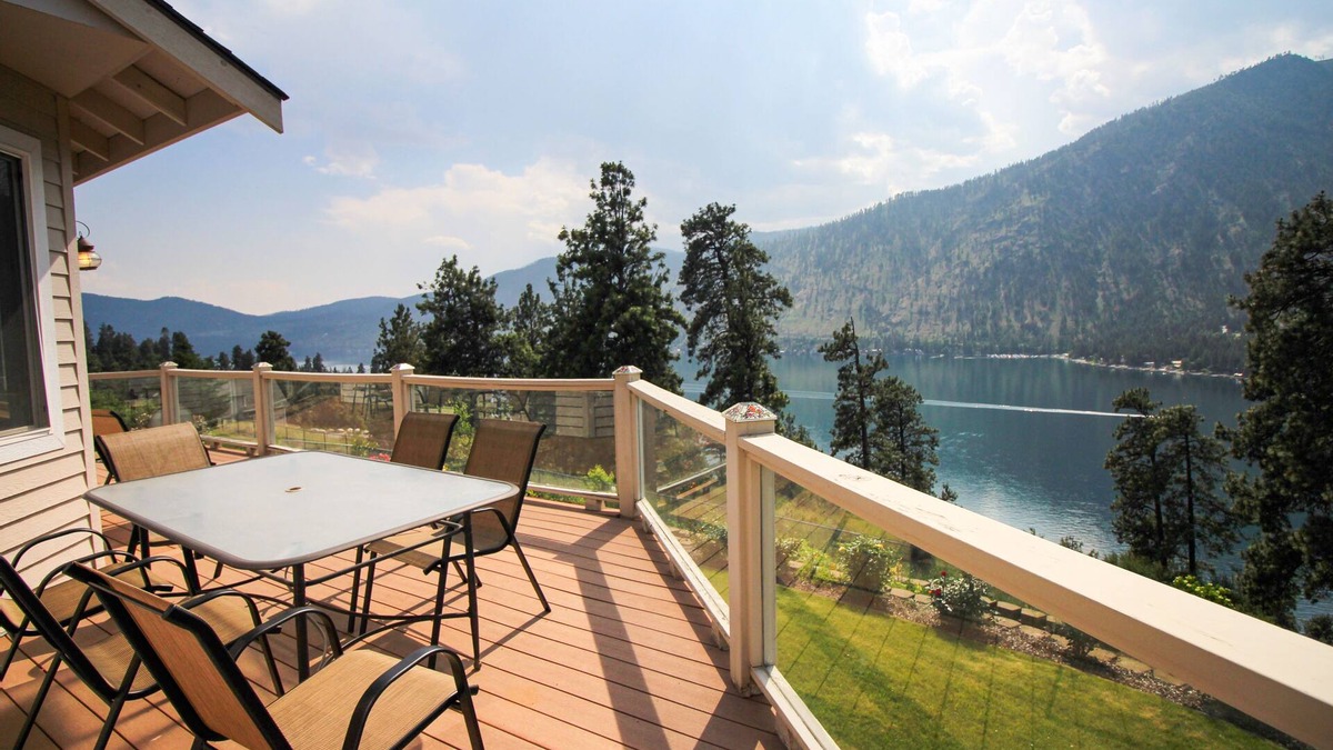 Helios Hills House | Spacious & Welcoming Home with Lake View, Private Hot Tub, & Wraparound Deck
