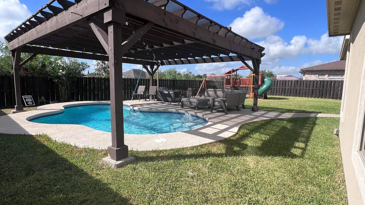 Brownsville House | Stately retreat with backyard oasis - pool, inviting patio - plus modern kitchen