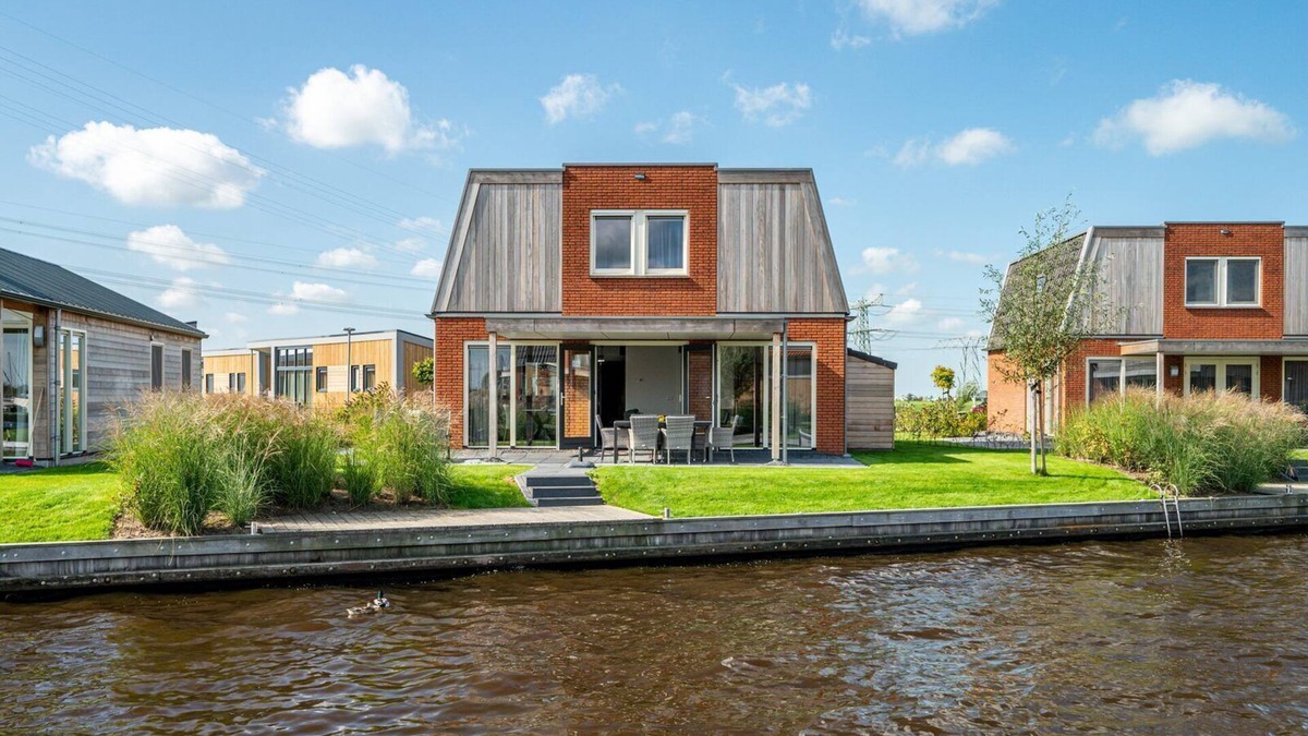 Akkrum House | Stay in our spacious Sneekermeer 6 home with private jetty.