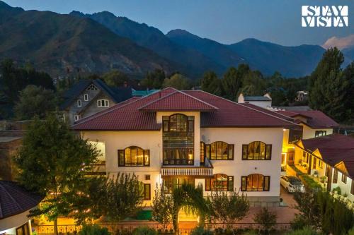 Brein Villa | StayVista at Wooden Arches with Lawn, Jacuzzi & BBQ