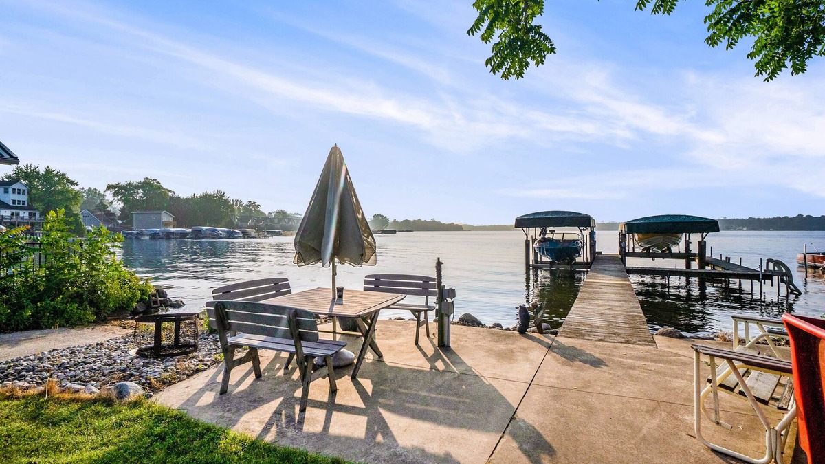 Paw Paw Lake House | Stealth Cottage | Lakeside historic stay with a dock, bars, and athletic courts