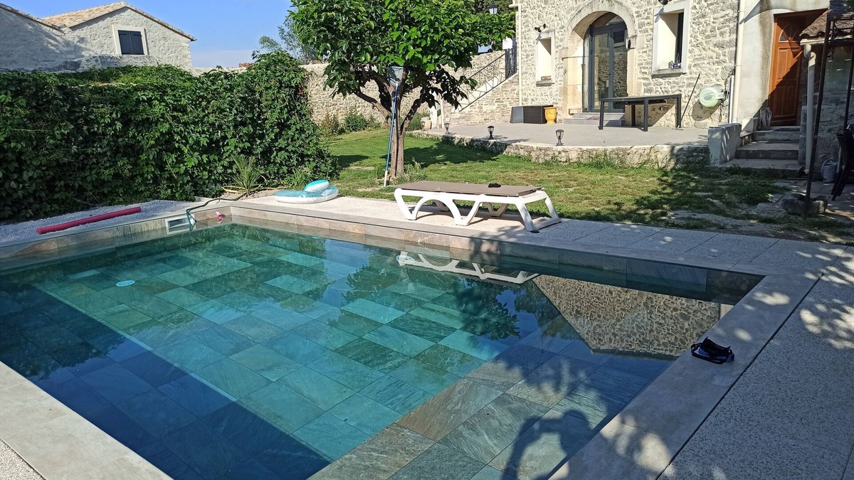 Fontanes House | Stone house renovated in a contemporary style with garden and swimming pool.