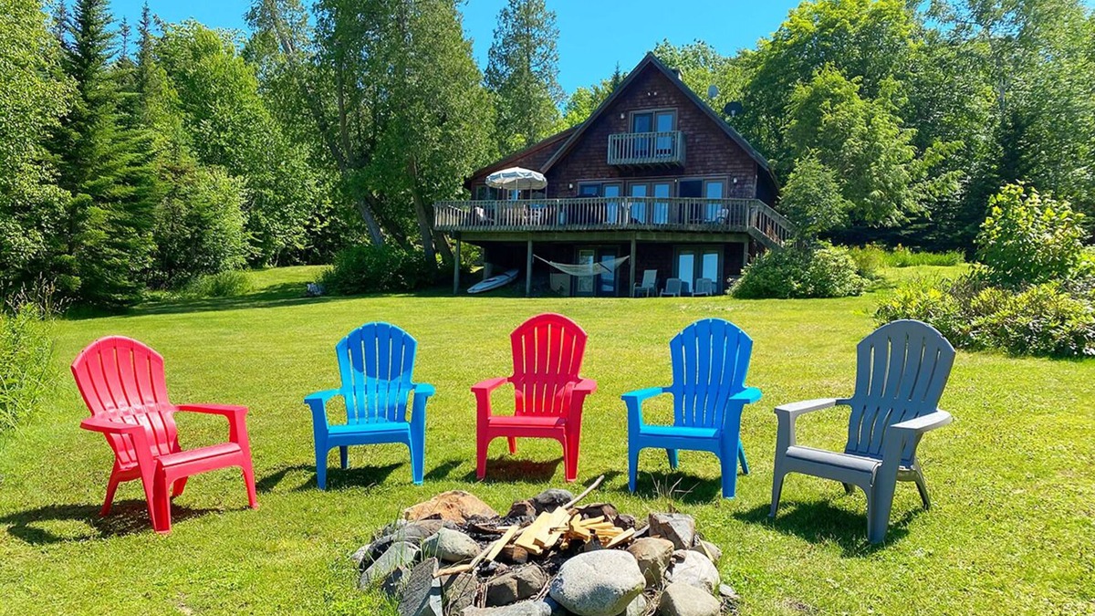 Rangeley House | Stone - This Rangeley Lake home has a very level entry to the water with a huge deck!