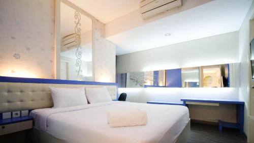 Surabaya Apartment | Strategic and Comfy 2BR Apartment at Trillium Residence By Travelio