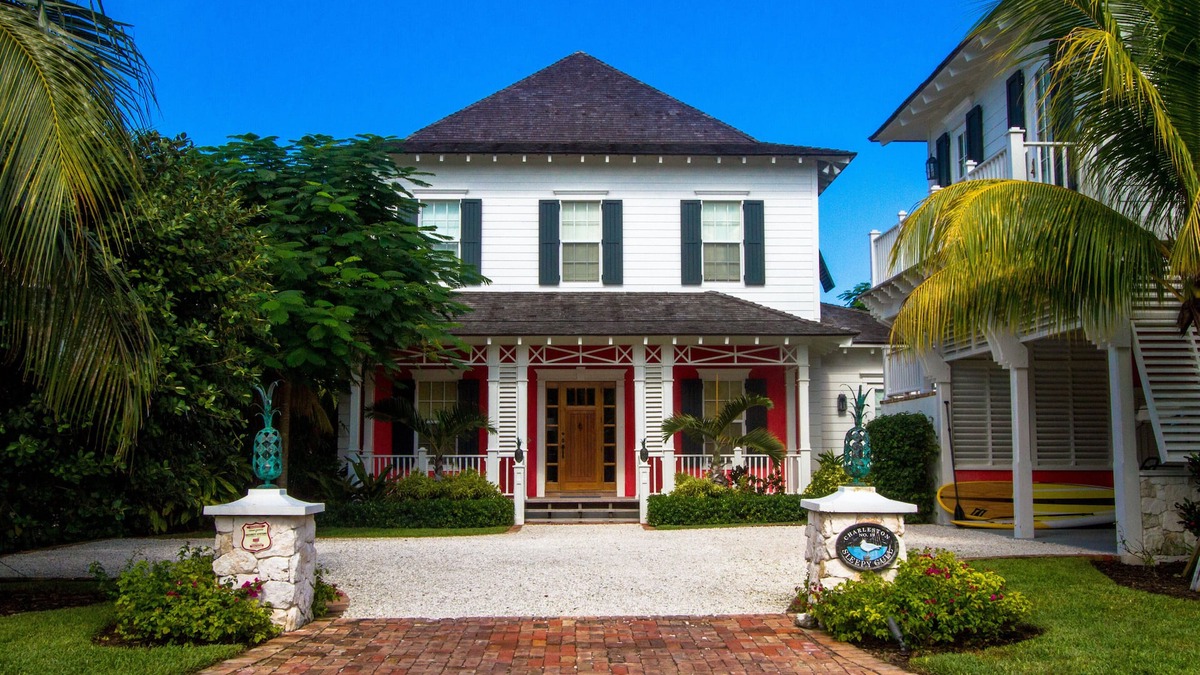 Old Fort Bay House | Stunning 6 bedroom on canal, pool, golf cart & optional Old Fort Bay Club access