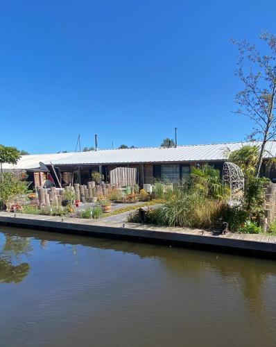Aalsmeer House | Stunning Island Home with African Asian Vibe