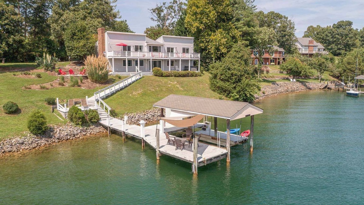 Huddleston House | Stunning Lake Home with Private Dock, Spa, Fire Pit