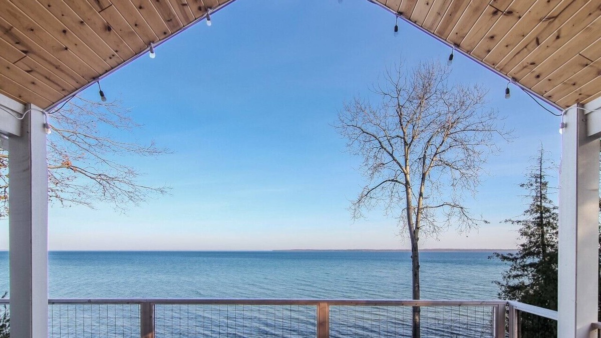 Suttons Bay House | Stunning Lakefront Home With Dock and Boat Lift