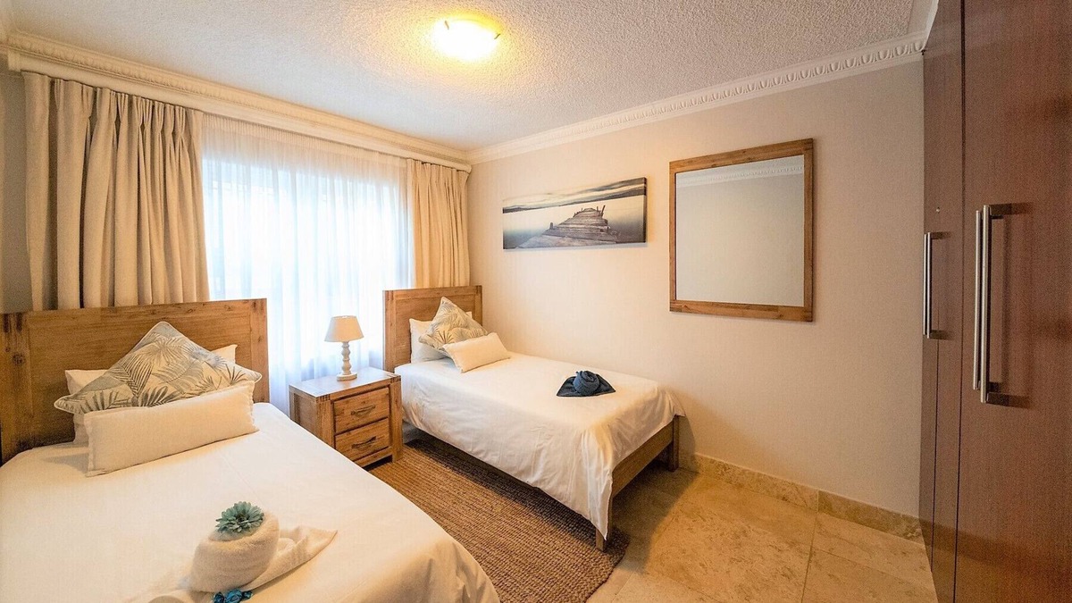 Jeffreys Bay Apartment | Stunning ocean vistas, near top surf spots, shops; private, all amenities.
