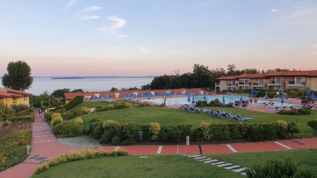 Manerba del Garda Apartment | Stunning three-room lake view in a residence with three swimming pools and 36,000 m2 of greenery