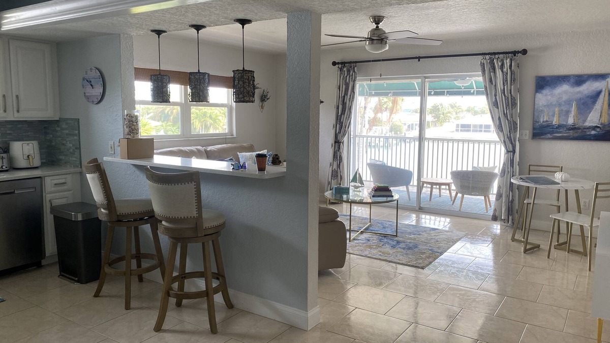 Capri Isle Apartment | "Stunning Waterfront Apartment on Treasure Island with Dock"