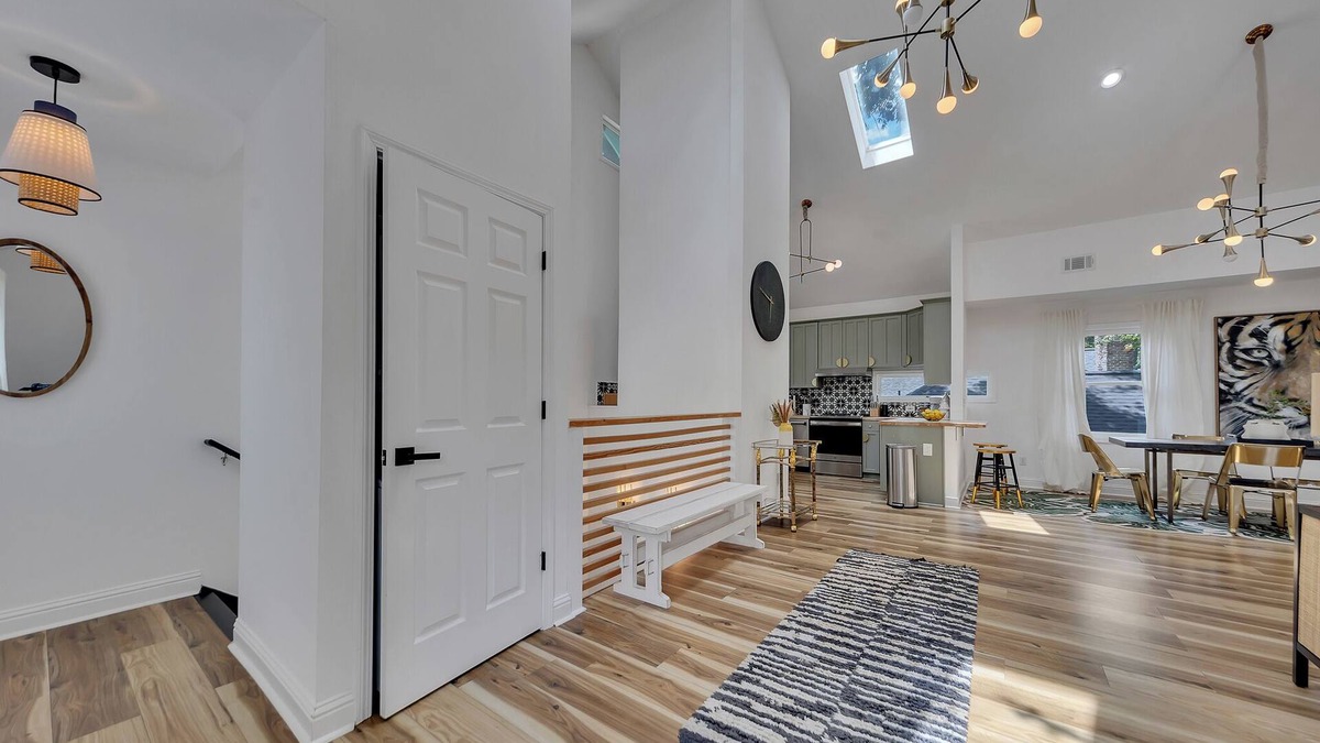 Inman Park Apartment | Stylish 3BR/3BA upper unit in fully remodeled 1920s duplex. Vaulted ceilings, updated kitchen, smart TVs, and private balcony. Perfect for families or groups in walkable Inman Park near BeltLine, dining, and MARTA.