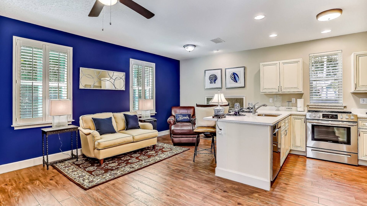 American Beach Condo | Stylish & sun-filled retreat with large patio & fireplace - near beaches & golf