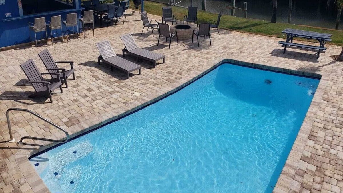 Butler Beach House | Sunbather – Waterfront Oasis with Heated Pool and Spacious Outdoor Living