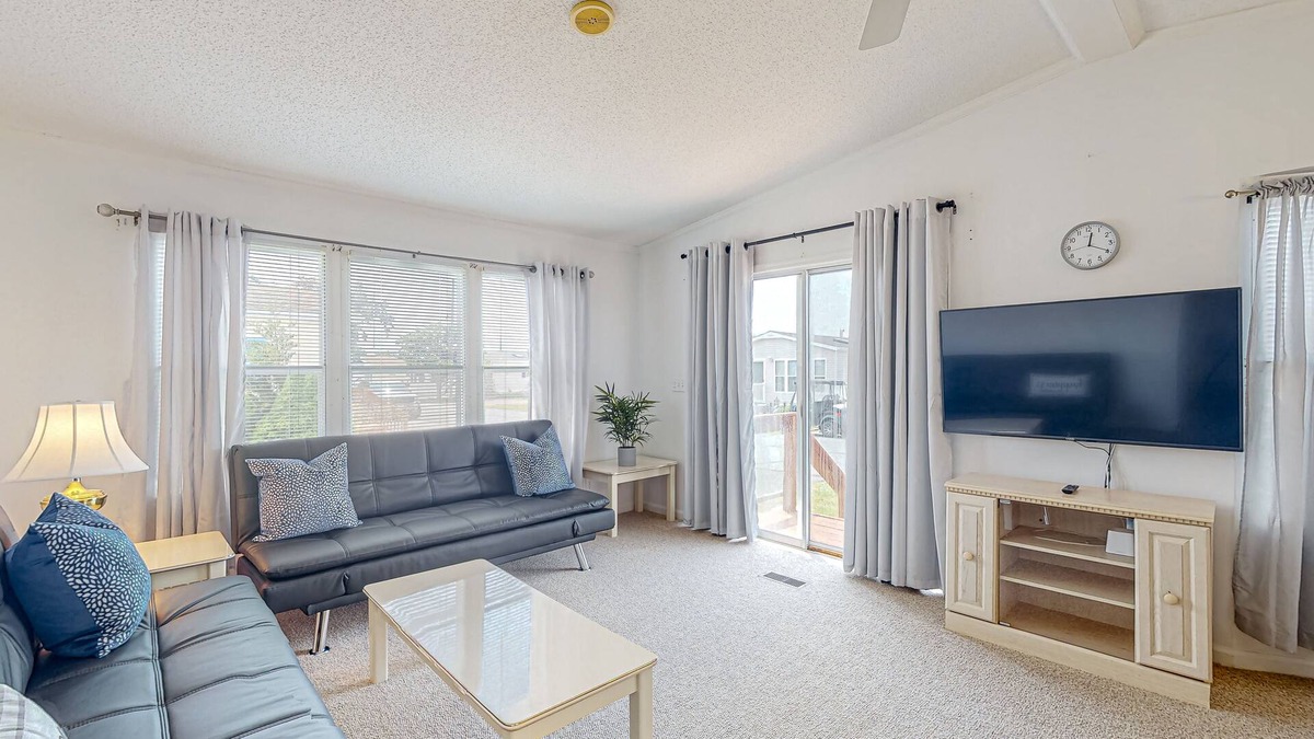 Assateague Pointe House | Sunny coastal home with private patio, on-site pool, central AC, & W/D