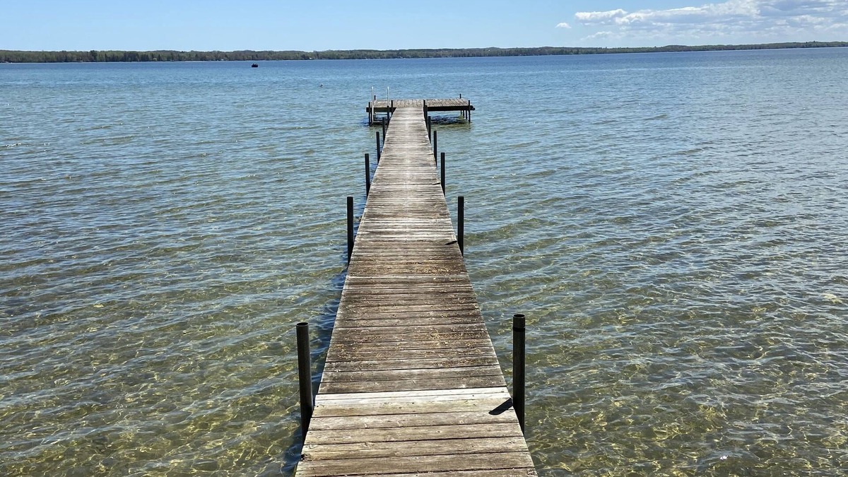 Mullett Lake House | Sunrise on Mullett Lake, 115' Lakefront sandy bottom, private dock, new remodel