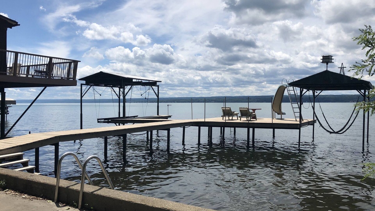 Town of Ledyard Cottage | Sunset Haven, lakefront on Cayuga Lake w/ Hot Tub, Waterslide & Boat Lift