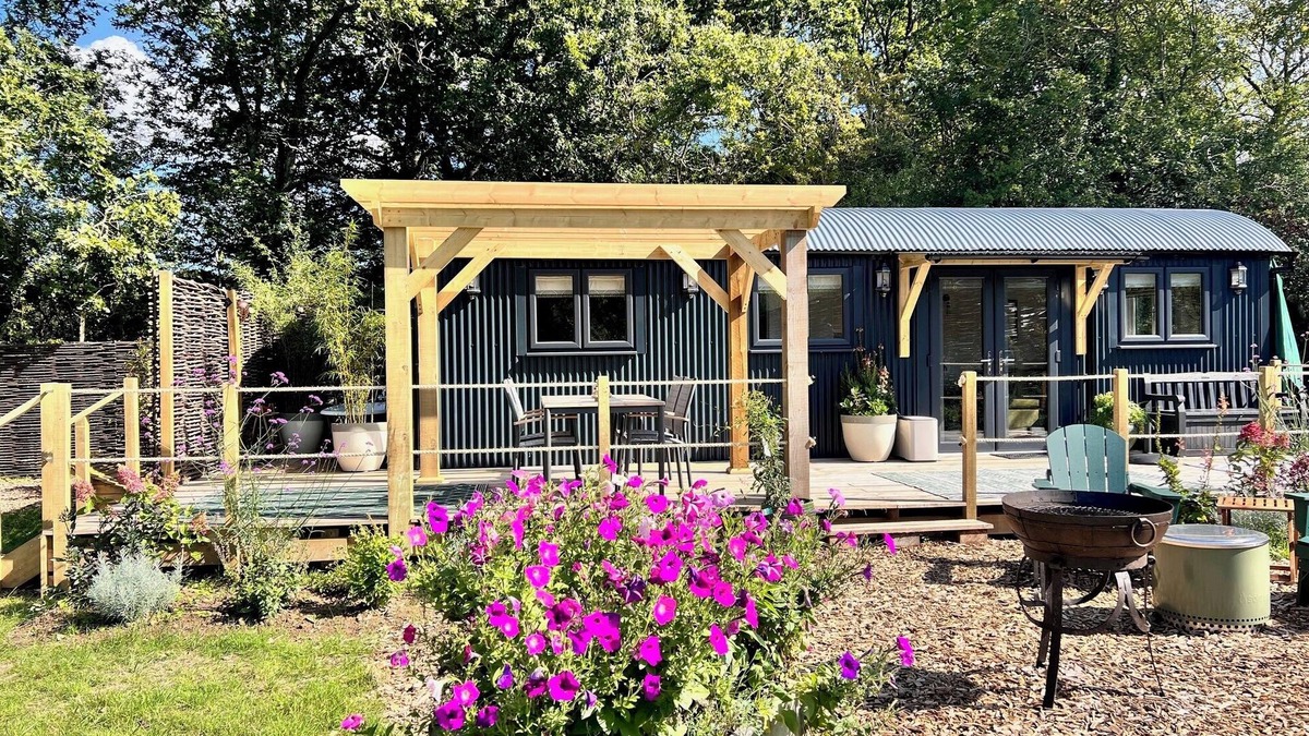 Pulborough Cabin | Sunset - nestled in a wildflower meadow on a farm with Highland Cows