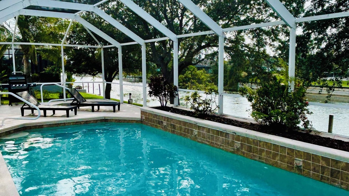 Cape Coral Villa | Sunset view Waterfront Villa with Pool & Spa. Family & Pet-Friendly