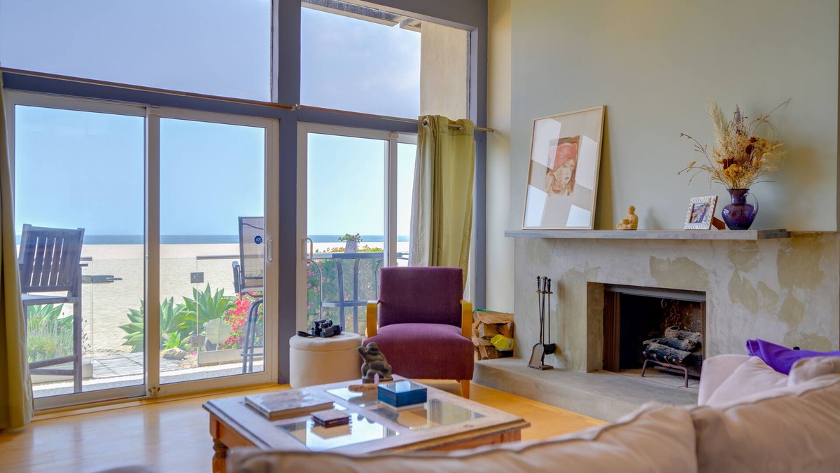 Marina Peninsula Condo | Sunsets and sweeping views, sliding doors open to the sand