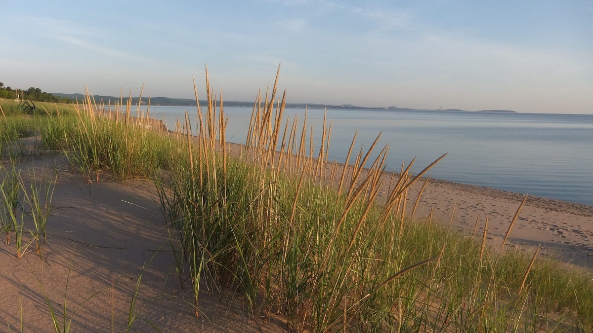 Upper Peninsula Michigan Cottage | Superior Beach House - White sand beach & Lake S just steps from front door!