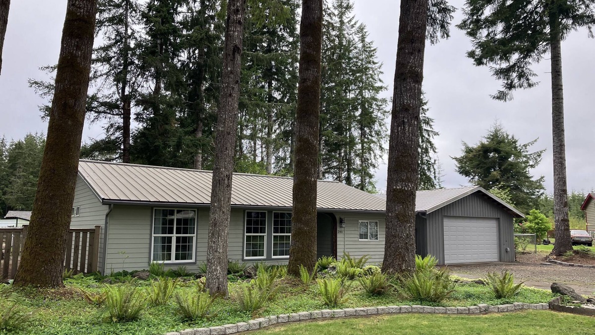 Forks House | Surrounded by trees, this 3-bedroom, fully stocked retreat sleeps 8.