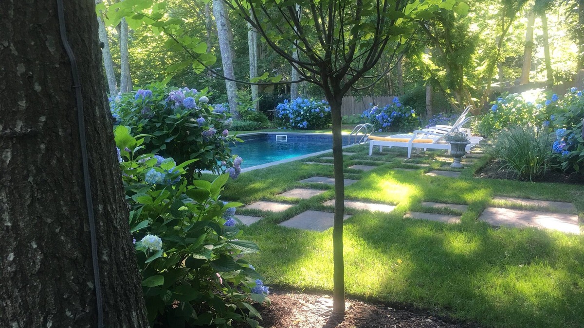 Water Mill House | Swim in a sea of hydrangeas on this peaceful, bucolic property.