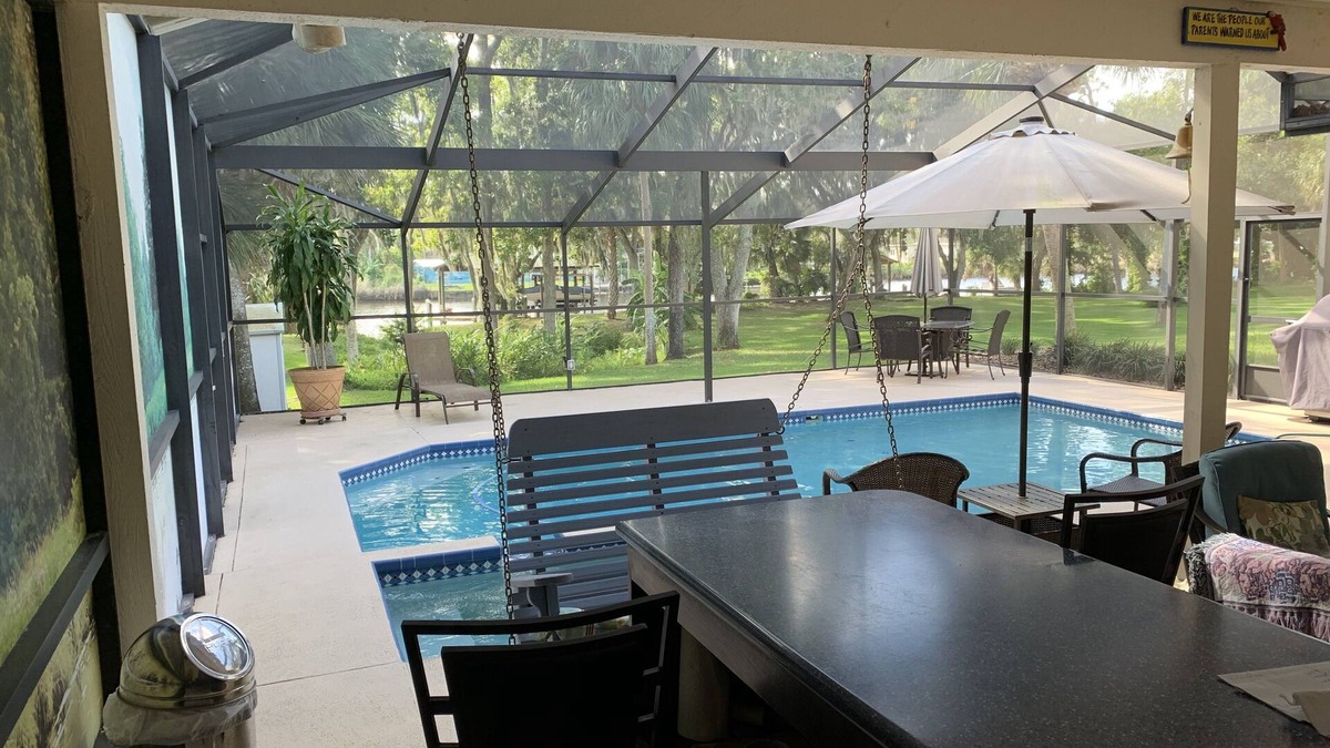 Riverview House | Tampa area home with solar-heated pool, hot tub, river and large dock.
