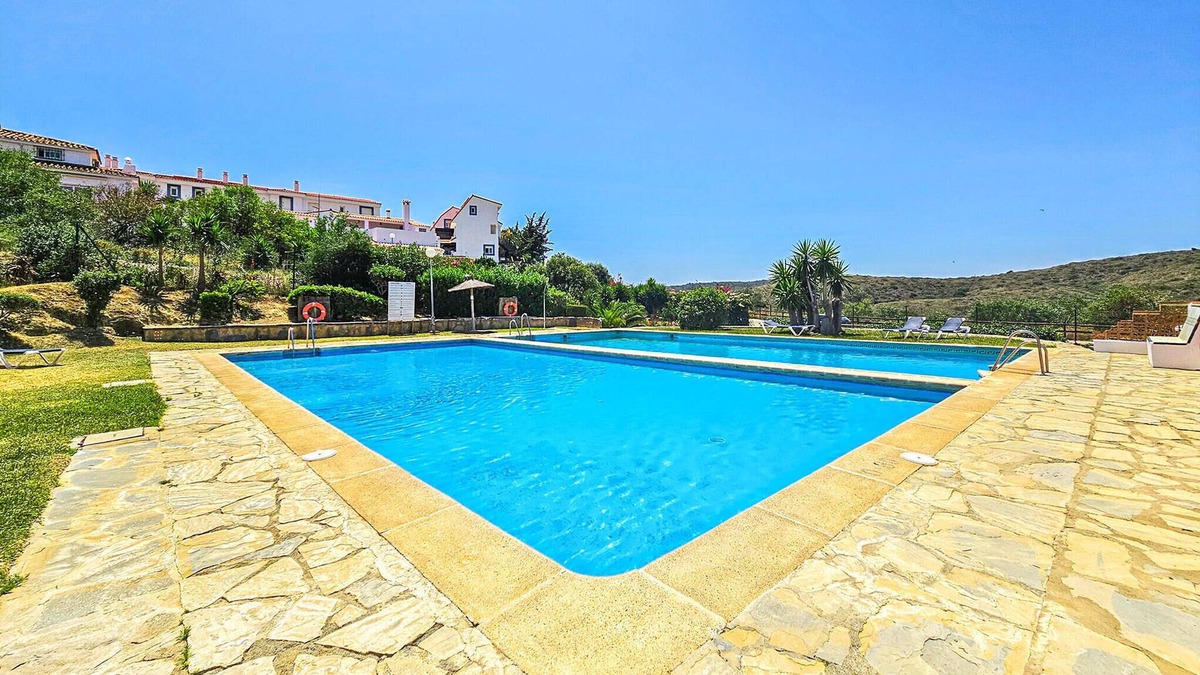 Alcorrin Apartment | Tasteful vacation apartment with shared outdoor pool and beautiful sea view.