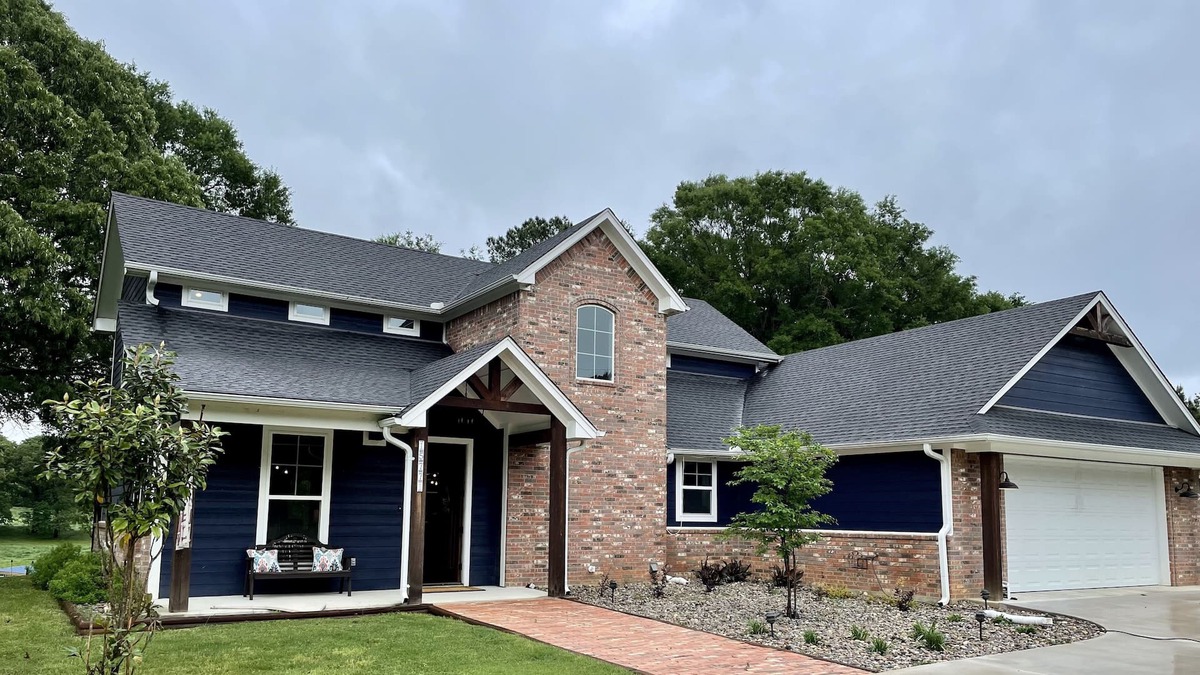 Tyler House | The Blue House on Two Lakes