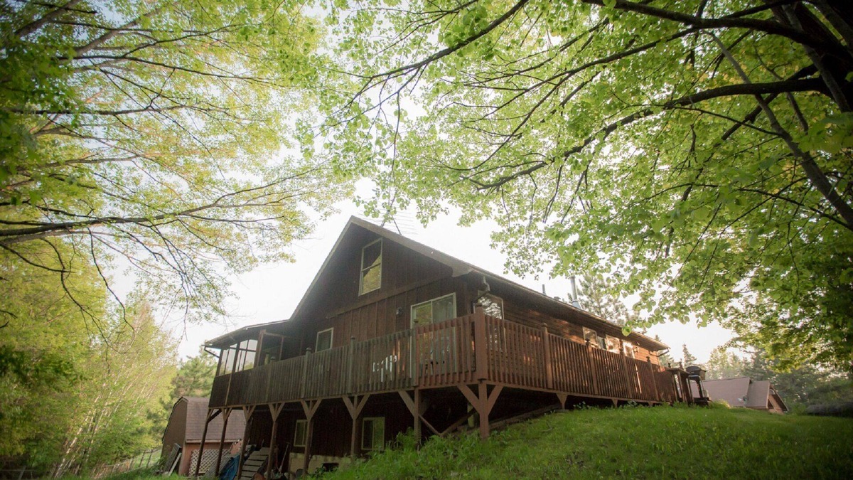 Finlayson House | The Cedar House Is Uniquely Set In The Forest Surrounded By Decks And Porches.