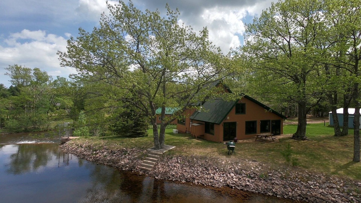 Big Bay House | "The Dam House" Lake and River Front Home with Beautiful Sunset Views