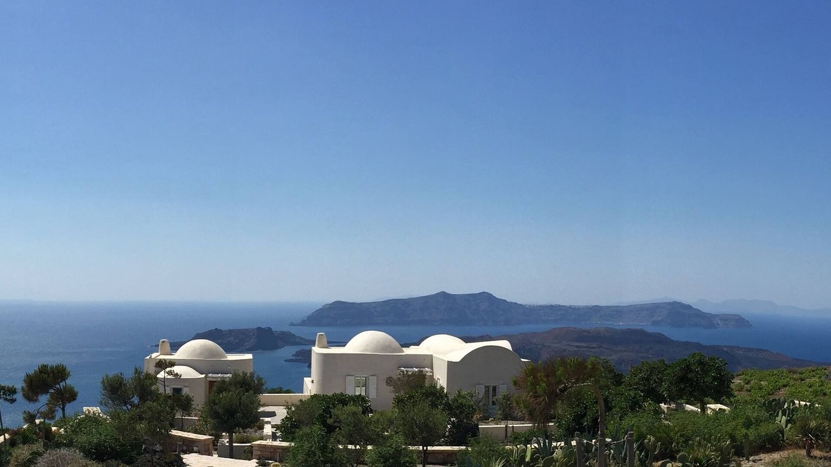 Santorini Villa | The Dome House: stunning sea views, garden, pond and squash court