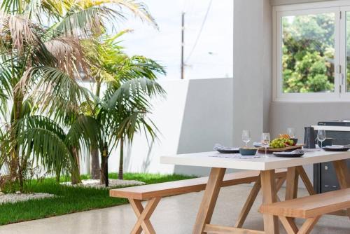 Christies Beach Apartment | The Elements l Air l 4 Stunning Apartments each with Private Outdoor Dining l Walk to the Beach l Event Friendly l Wifi l Netflix l Outdoor Shower l Communal BBQ Pavilion and Lawn Area l