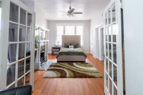 Woodland Heights Apartment | The Great Pink Lady with Huge Wrap Around Porch!