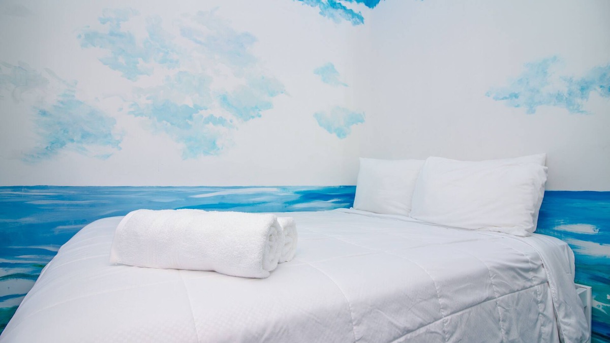 Queens Condo | The High Tide Studio #6 Studio Bedroom Hotel Room by RedAwning