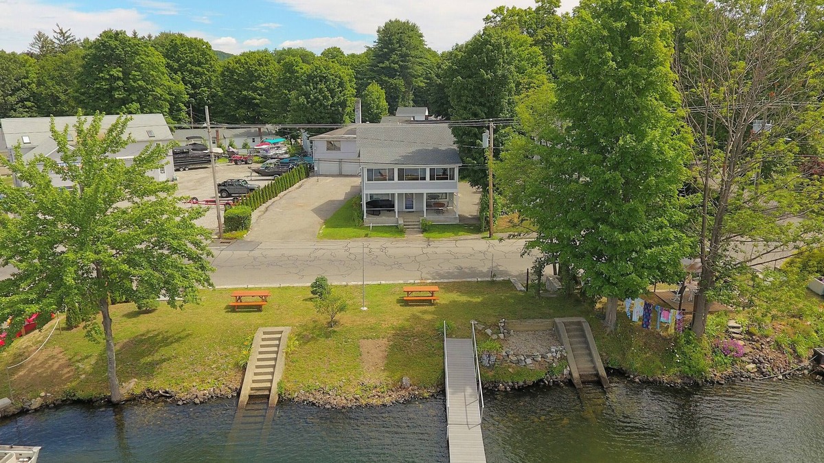 Winchester Apartment | The Inn at Highland Lake, 1st Floor, waterfront yard with a boat dock