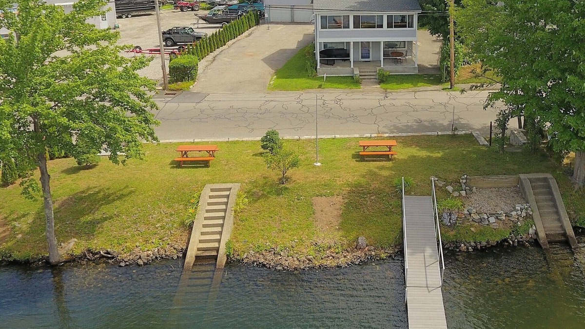 Winchester Apartment | The Inn at Highland Lake, 2nd Floor, waterfront yard with a boat dock