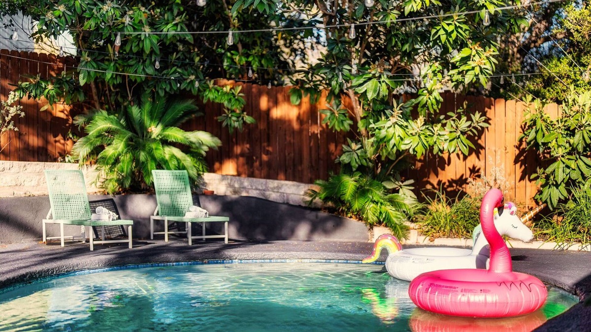 University Hills House | The Palm Royale: Mid century pool home in trendy East Austin sleeps 12!