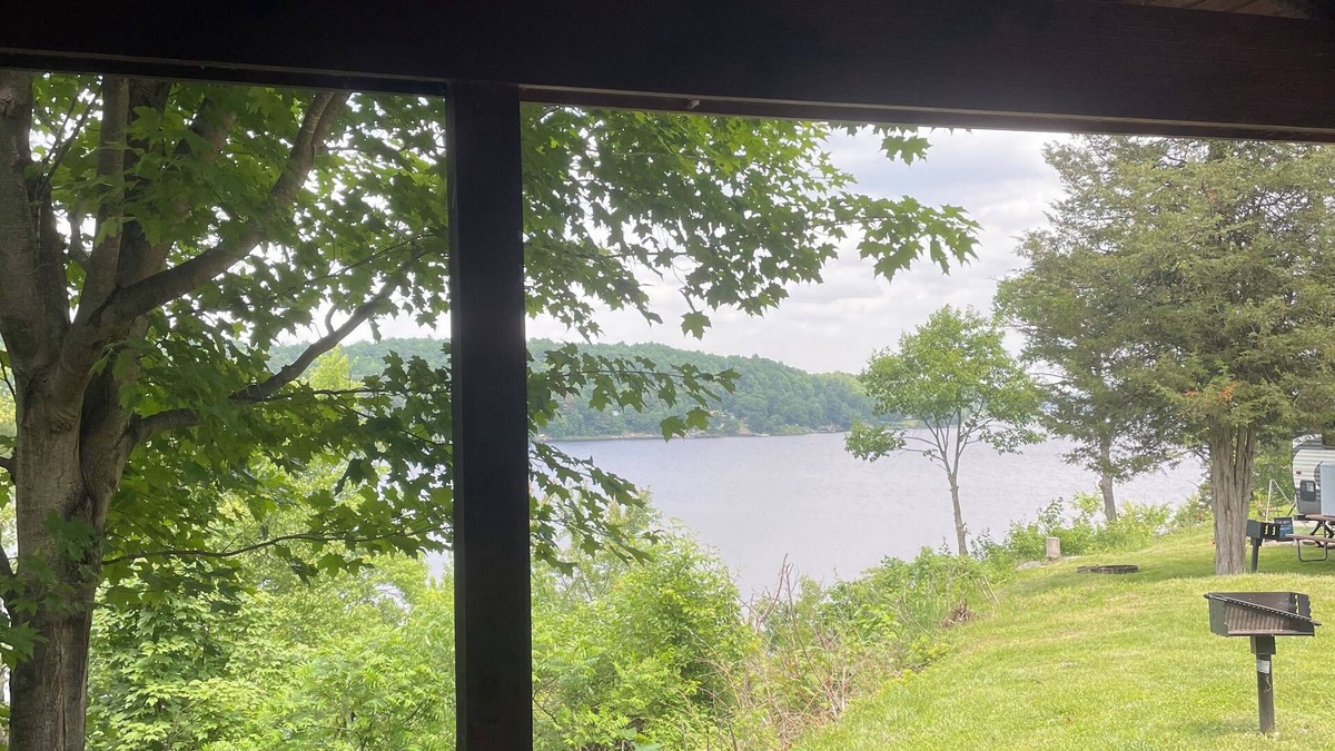 Hammond RV Rental | The Perch- Cliffside cabin with dock overlooking Black Lake
