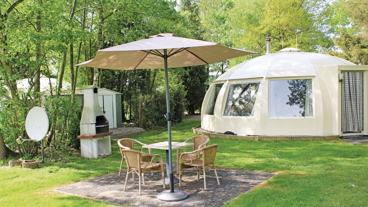 Municipality of Alphen-Chaam House | These detached bungalows with domed roofs are scattered in a wooded resort.
