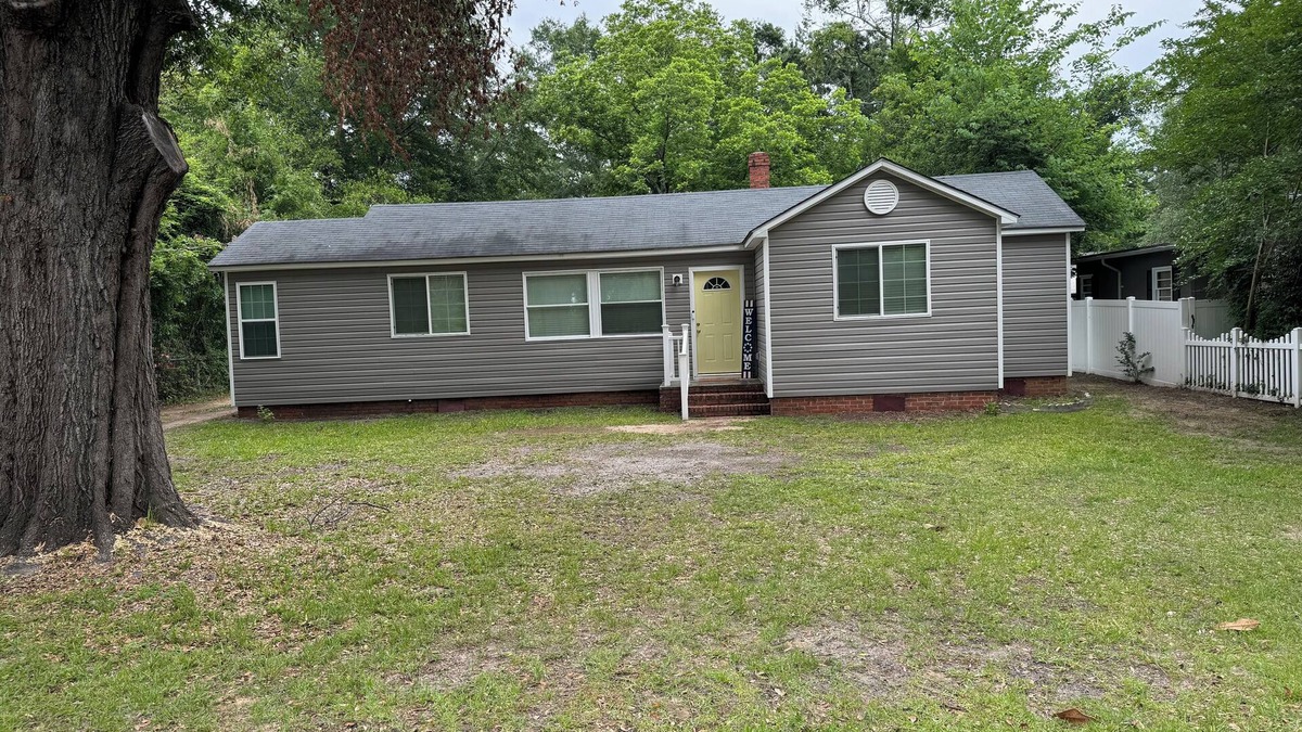 Sumter House | This charming 2-bed, 1-bath house offers a warm sanctuary for those on the go.