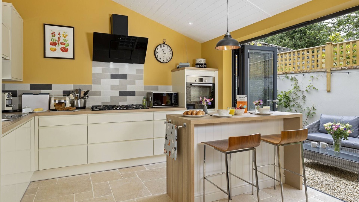 Minchinhampton Cottage | This charming Cotswold stone cottage, elegantly furnished with a seamless blend of antique and conte