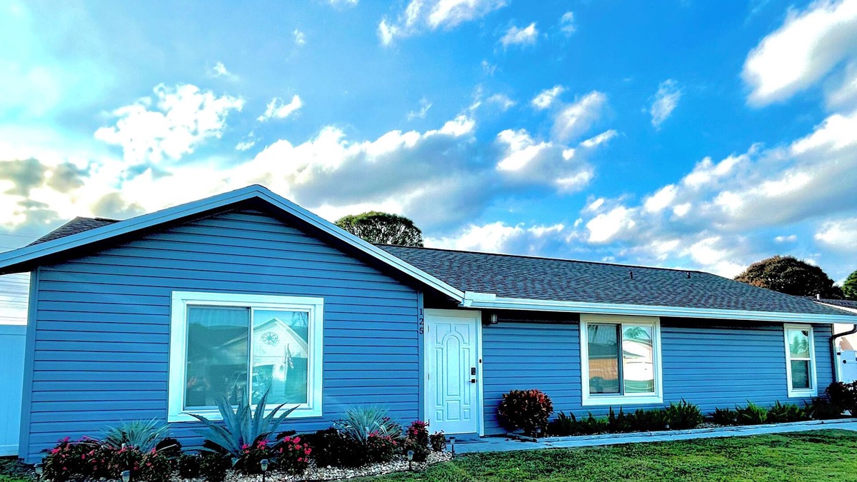 Royal Palm Beach House | This Charming 3-bedroom house in Royal Palm Beach offers comfort and style!