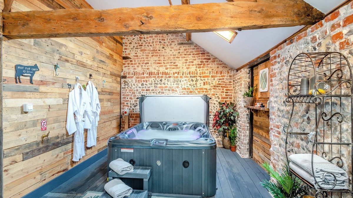 Ingham Cottage | This picture-perfect barn conversion, boasts a private hot tub and sauna.