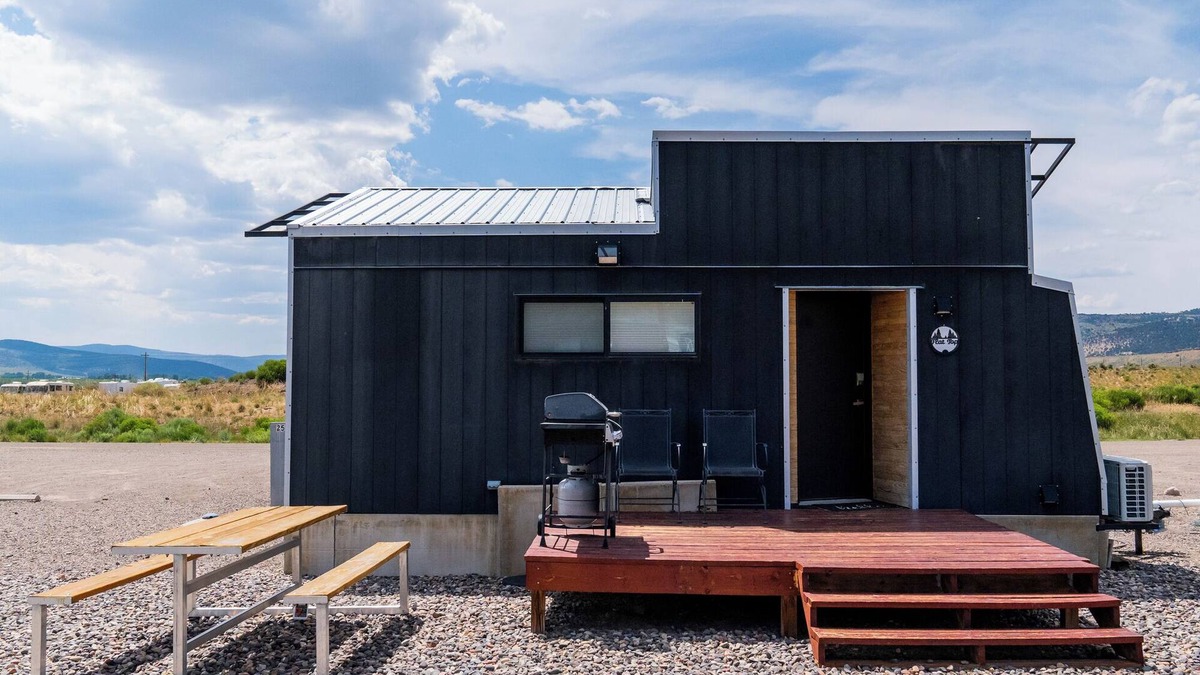 Meeker House | This Tiny Home is custom made by a Colorado craftsman has one Queen bed in loft accessible by stairs and also has a fold out Full futon on main level. Sleeps up to 4. Please note, this home does have a sleeping area in a loft. If you require an accom