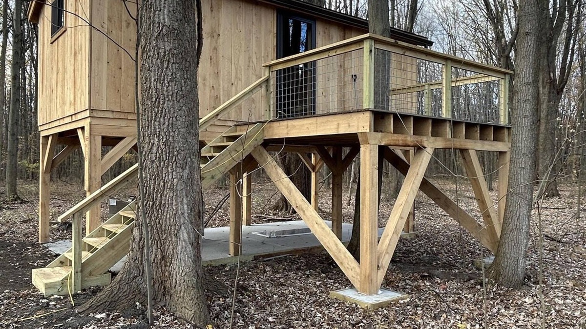 Girard Cabin | Timber framed tree cabin nestled in the woods.